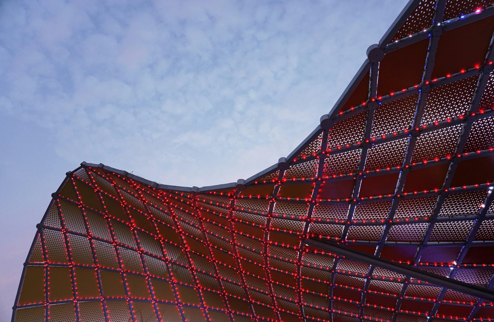 a close up of a building with red lights on it