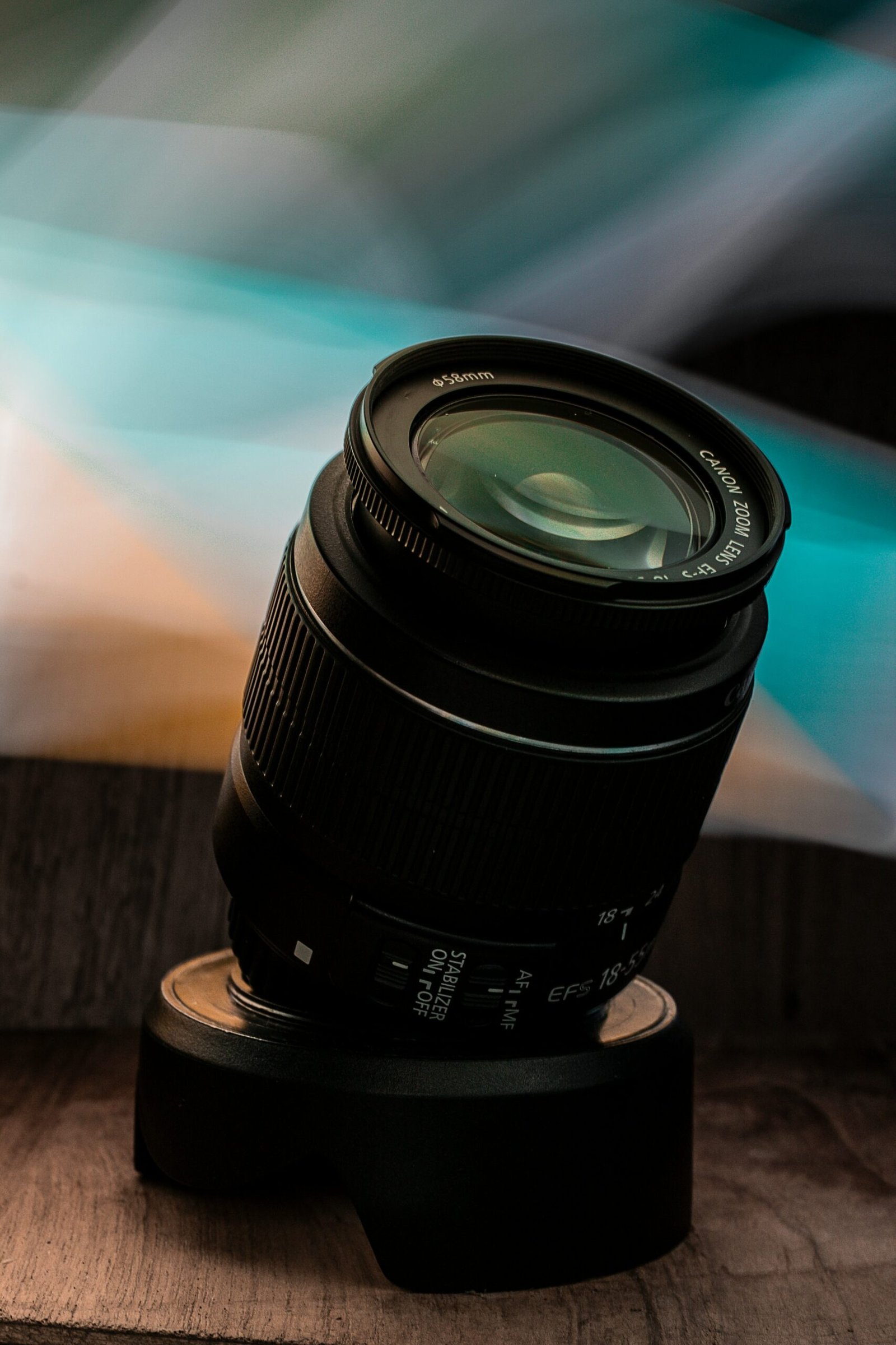 black camera lens on brown wooden table